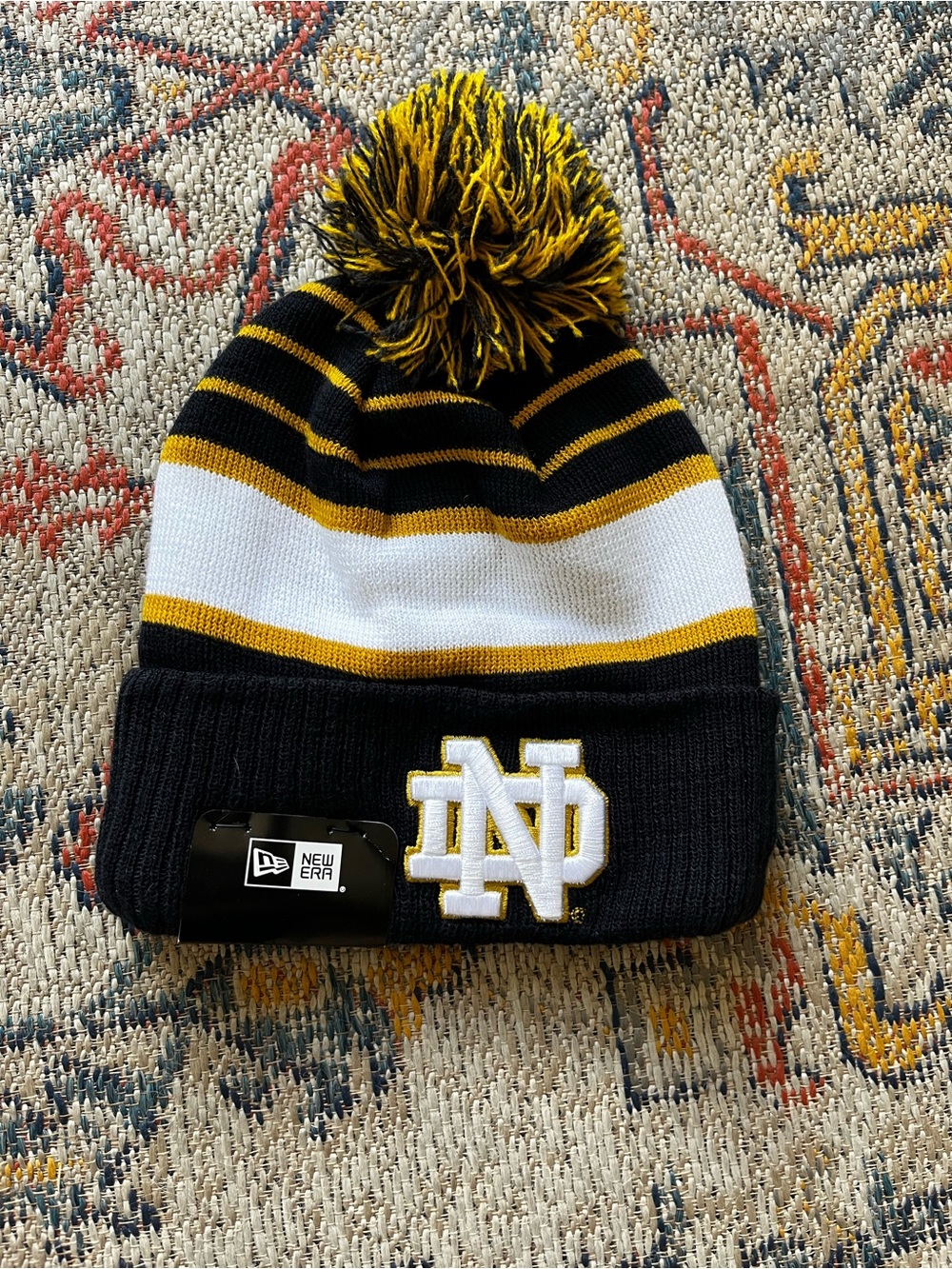 New Era Kids Notre Dame Pom Beanie in Black, Gold & White